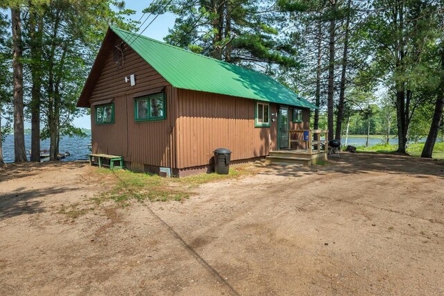 view of property exterior featuring a water view