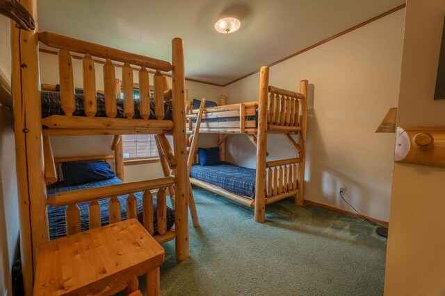 bedroom with carpet and ornamental molding