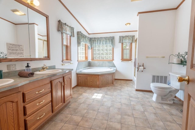 bathroom with a tub to relax in, tile patterned floors, vanity, crown molding, and toilet