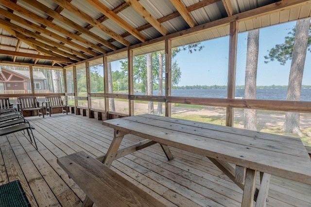 unfurnished sunroom with lofted ceiling