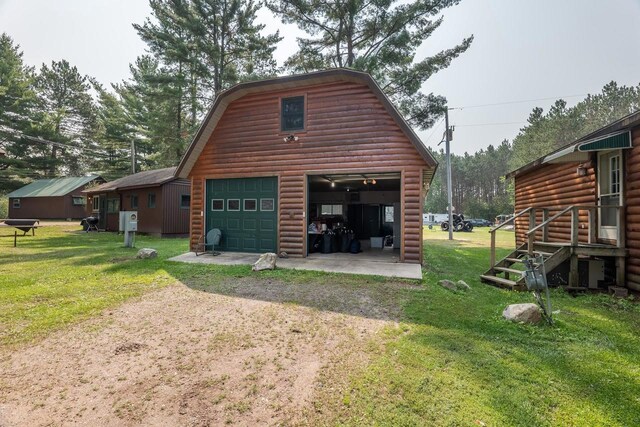 garage featuring a lawn