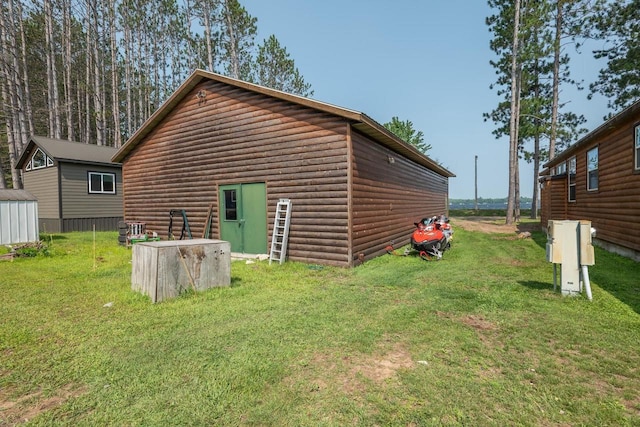 view of side of property with a lawn