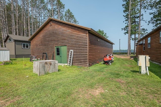 view of property exterior featuring a lawn and faux log siding