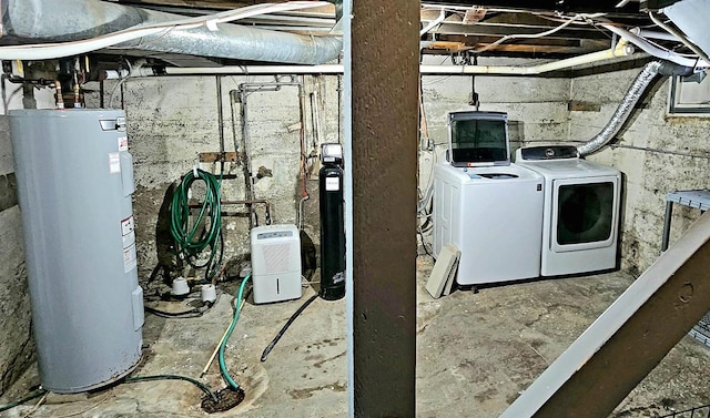 laundry area with laundry area, independent washer and dryer, and electric water heater