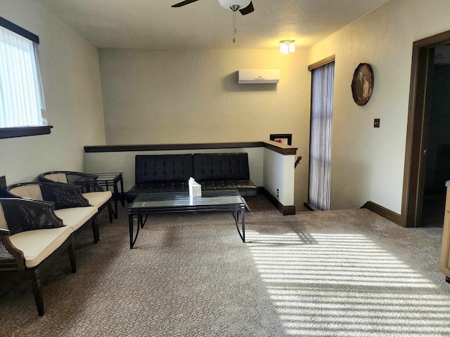 sitting room with carpet flooring, baseboards, and ceiling fan