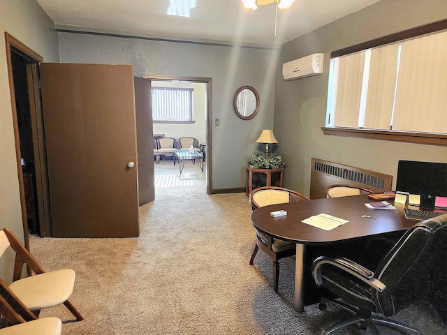 office space featuring a wall unit AC, radiator, light colored carpet, and baseboards