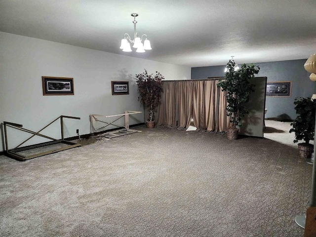 unfurnished room featuring an inviting chandelier and a textured ceiling