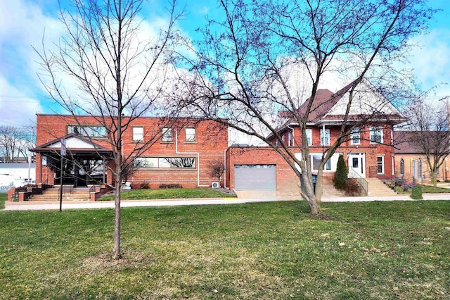 view of front of home featuring brick siding, an attached garage, and a front lawn