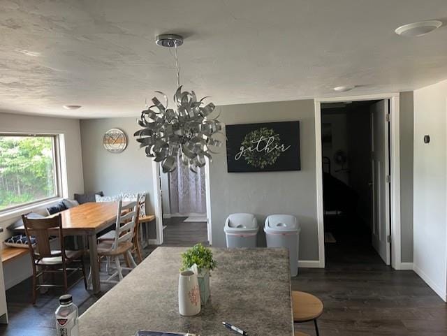 dining space featuring dark wood-type flooring