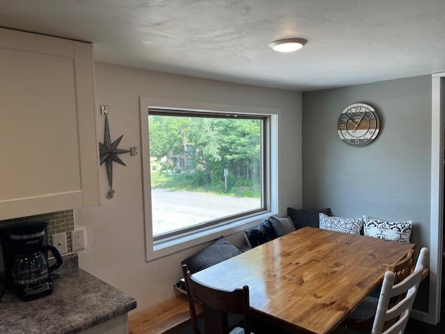 dining space with hardwood / wood-style floors