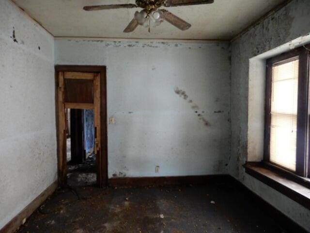 unfurnished room featuring a ceiling fan