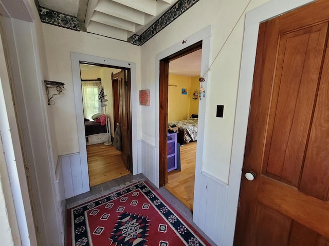 corridor featuring hardwood / wood-style flooring