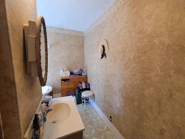 bathroom with tile patterned floors and vanity