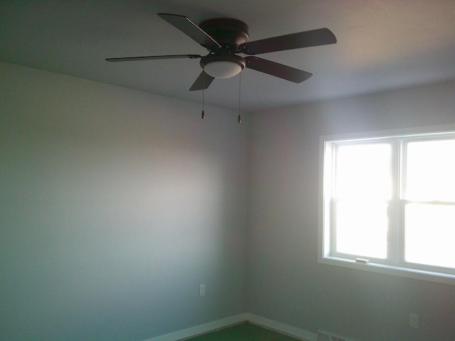 unfurnished room with ceiling fan