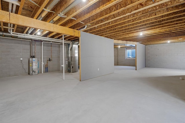 basement with water heater and heating unit