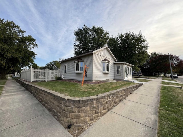 view of home's exterior with a yard