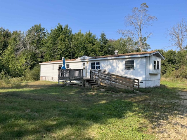 N9185 9th Ave, New Lisbon, WI 53950 - back of house featuring a deck and a yard