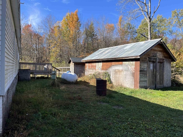 N9185 9th Ave, New Lisbon, WI 53950 - view of green lawn with an outdoor structure and a deck