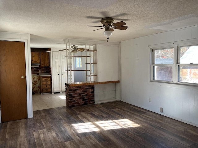 N9185 9th Ave, New Lisbon, WI 53950 - unfurnished room featuring ceiling fan, wood finished floors, and a textured ceiling