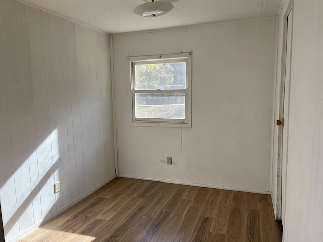 N9185 9th Ave, New Lisbon, WI 53950 - empty room featuring wood finished floors and wooden walls