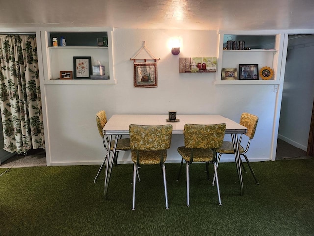 dining area with carpet and built in shelves