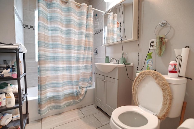 full bathroom with toilet, shower / tub combo, tile patterned floors, and vanity