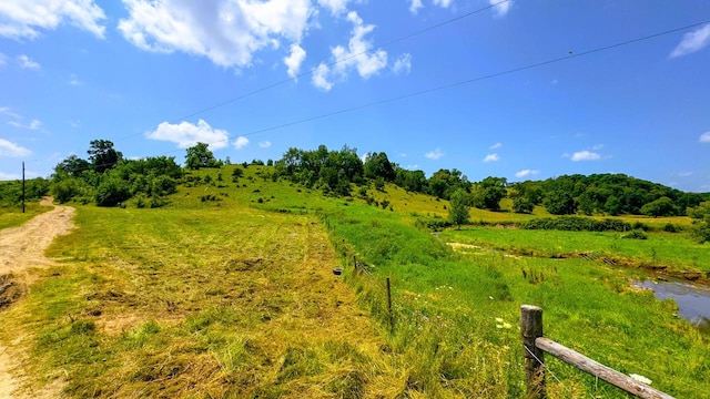 view of yard with a rural view