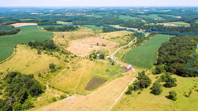 bird's eye view with a rural view and a water view