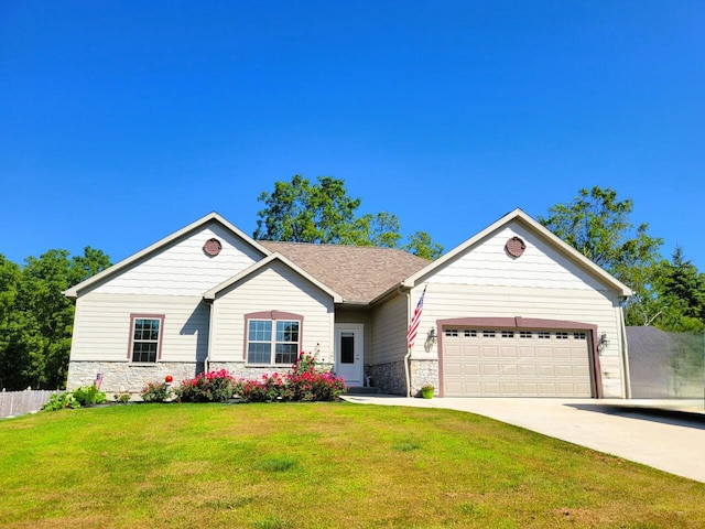 ranch-style house featuring a garage and a front lawn