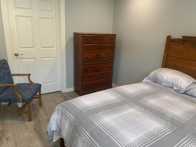 bedroom with light wood-type flooring