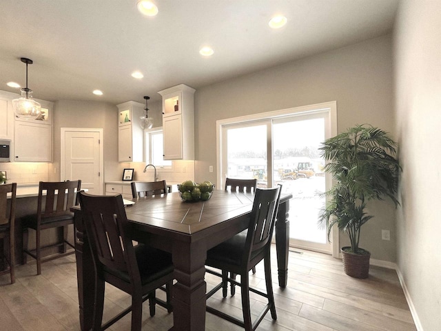 dining space featuring light hardwood / wood-style flooring