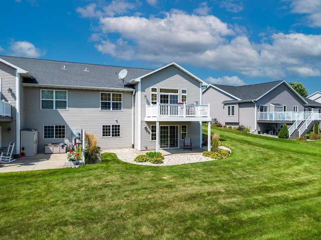 back of property featuring a patio area and a yard