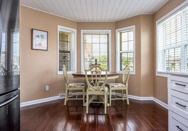 dining space featuring wooden ceiling, baseboards, and dark wood-type flooring