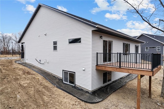 view of side of property with a deck