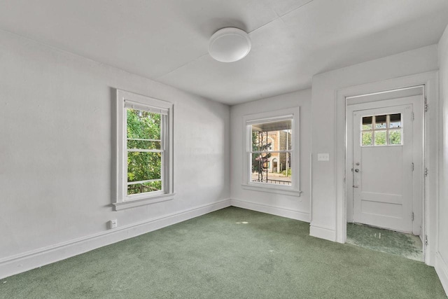 view of carpeted entrance foyer