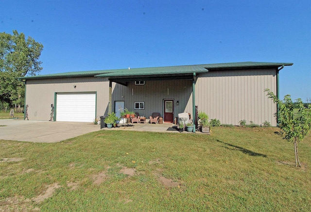7750 Pine Rd, Arena, WI 53503 - exterior space featuring a front yard, driveway, and an attached garage