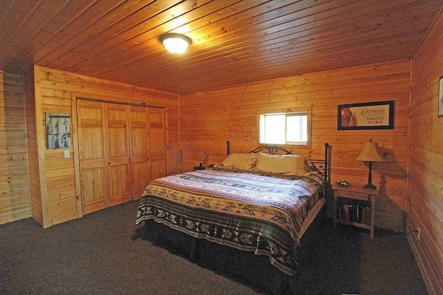 7750 Pine Rd, Arena, WI 53503 - bedroom featuring carpet, a closet, wood walls, and wood ceiling