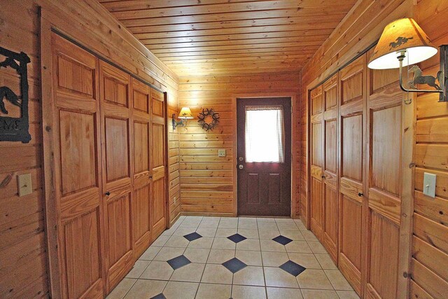 7750 Pine Rd, Arena, WI 53503 - interior space featuring light tile patterned flooring, wooden walls, and wood ceiling