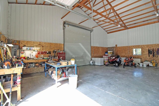 7750 Pine Rd, Arena, WI 53503 - garage featuring metal wall and a workshop area