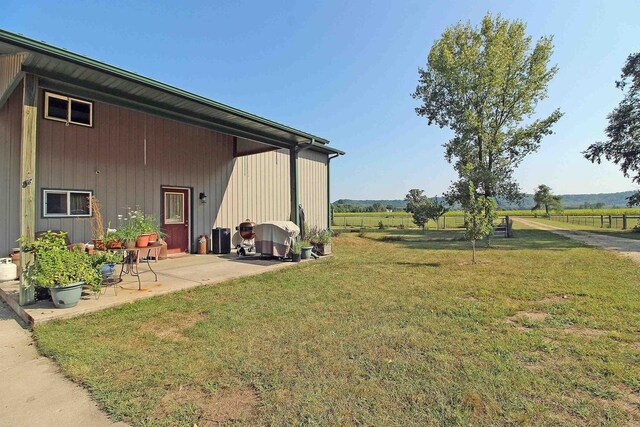 7750 Pine Rd, Arena, WI 53503 - view of yard featuring a patio and a rural view