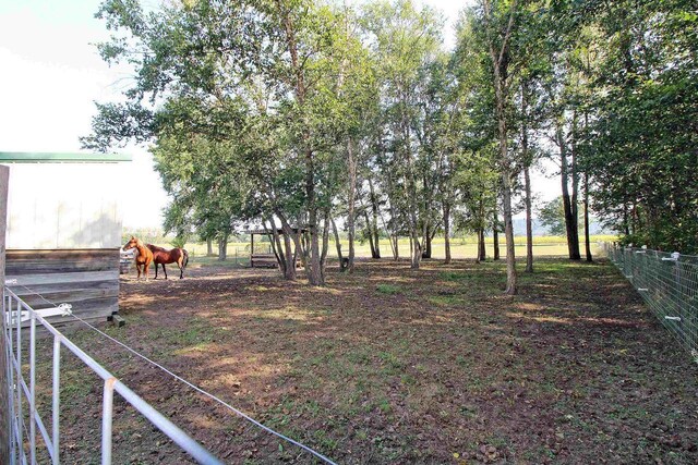 7750 Pine Rd, Arena, WI 53503 - view of yard with an outbuilding and fence