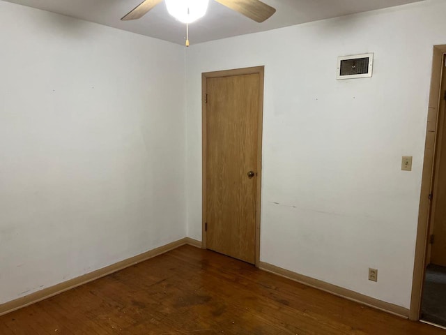 spare room featuring ceiling fan and wood-type flooring