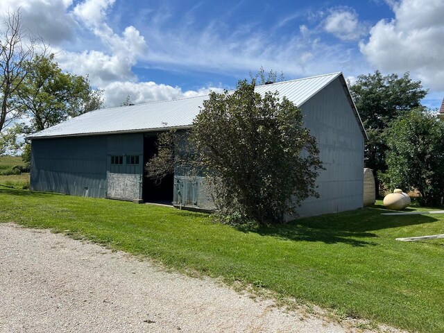 rear view of property with a yard