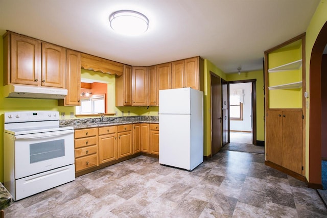 kitchen with tile patterned flooring, sink, and white appliances