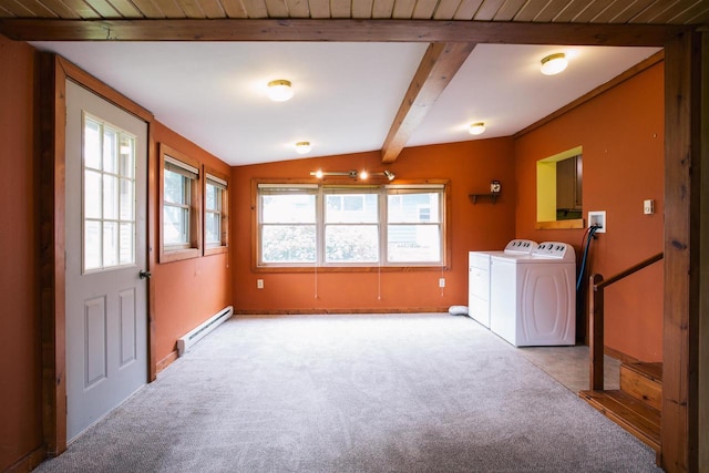 washroom featuring a baseboard heating unit, washer and dryer, and carpet flooring