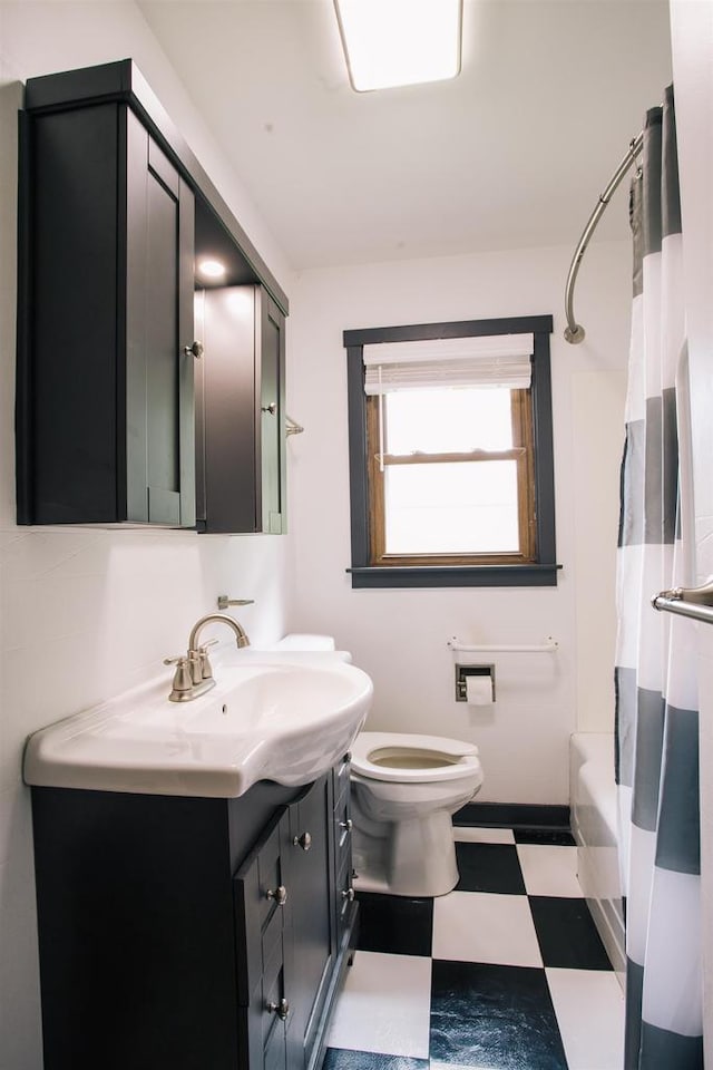 full bathroom featuring vanity, toilet, shower / tub combo with curtain, and tile patterned flooring