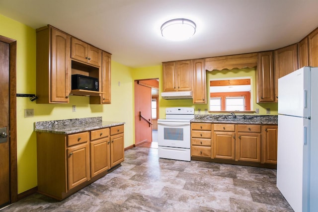 kitchen featuring white appliances, sink, and tile patterned floors