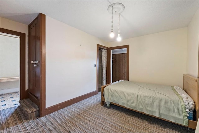 carpeted bedroom with baseboards