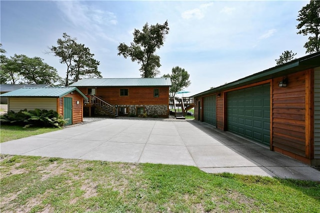 exterior space featuring an outdoor structure and a garage