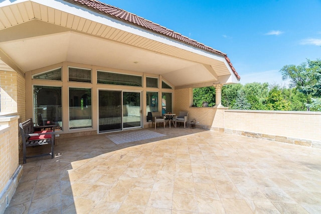 view of patio featuring fence